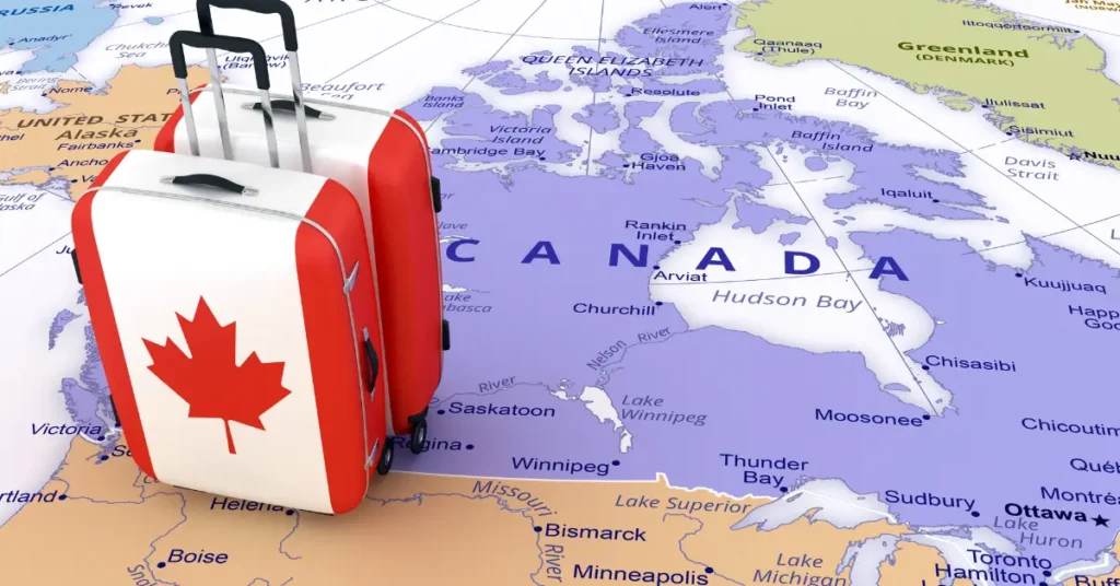 Suitcases on a Canada map representing Canadians preparing to relocate to Dubai for new business and residency prospects.