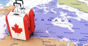 Suitcases on a Canada map representing Canadians preparing to relocate to Dubai for new business and residency prospects.