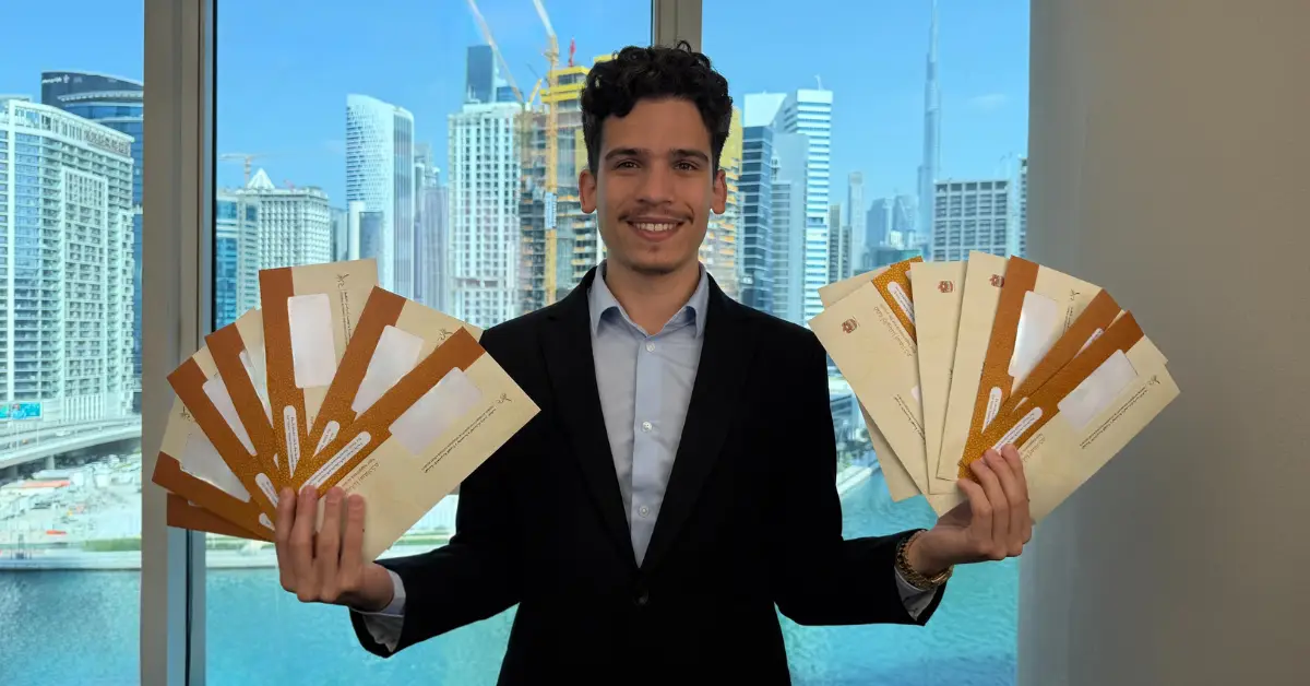 GenZone co-founder Kevin McKenzie celebrating a record day holding 14 Emirates IDs at the Business Bay office in Dubai