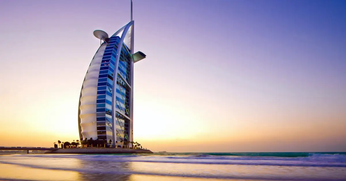 Burj Al Arab hotel in Dubai at sunset, symbolizing the opportunities and realities of relocating to Dubai in 2026