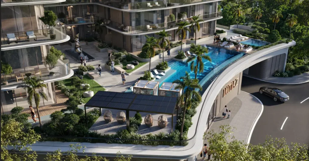 Exterior view of Inara Residence by Imtiaz showcasing modern architecture, curved balconies, greenery, and ground-floor retail