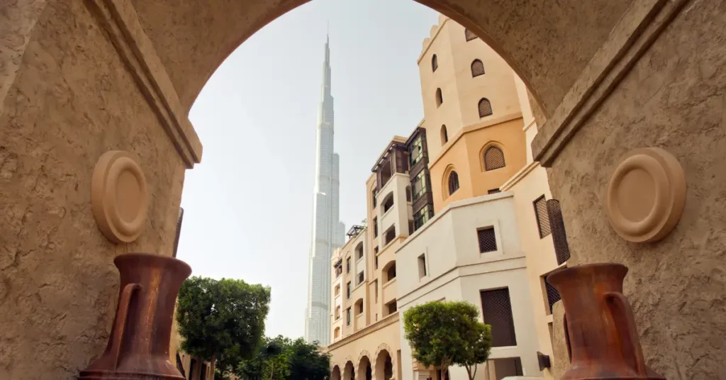 Traditional Dubai architecture with Burj Khalifa in the background, representing lifestyle, residency setup, and UAE tax residency planning