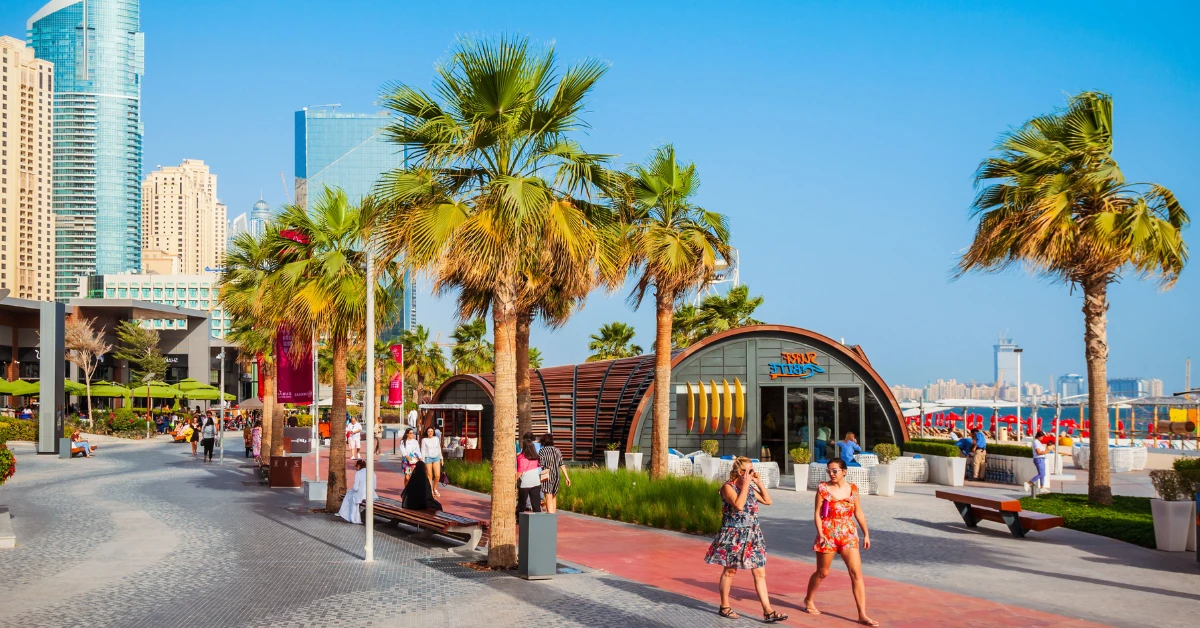 Dubai Marina Walk promenade with skyscrapers - ideal lifestyle for UAE residency and Golden Visa holders