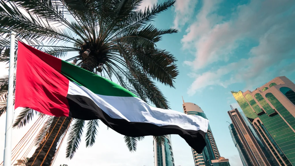 UAE flag with Dubai business district highlighting company formation and residency solutions
