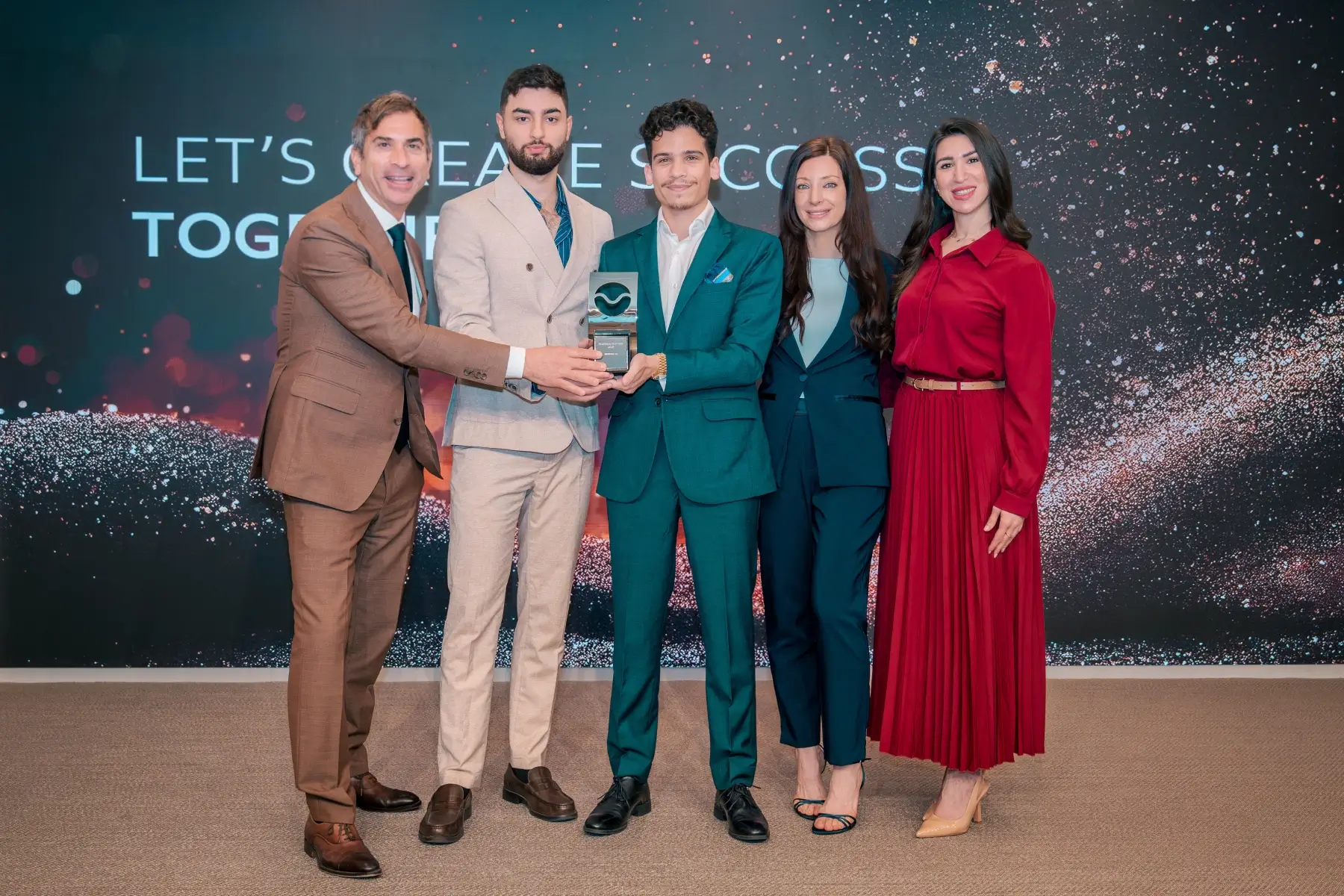 GenZone team holding the Platinum Partner government award